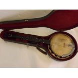 Vintage cased Banjo with a satinwood back (a/f), 38ins long