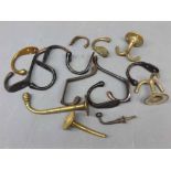 Box containing mixed brass and steel coat hooks