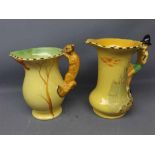 Two Burleigh ware yellow glazed jugs with decorative designed handles (a/f) largest 8ins tall