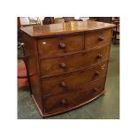 Victorian mahogany bow fronted two over three full width drawer chest with turned knob handles,