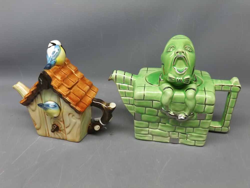 Two novelty teapots modelled as a blue tit's house and Humpty Dumpty sitting on a wall (2)