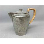 Tudric Pewter Ware hot water jug with wicker handle, serial no 01537, 6 1/2 ins tall