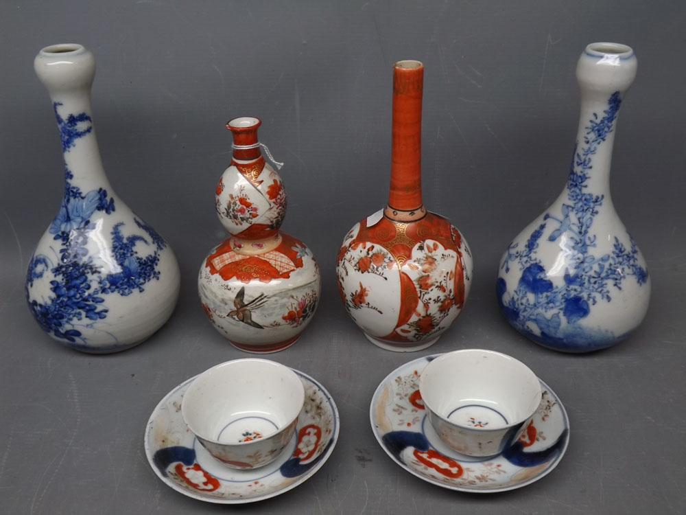 Two Kutani vases, two further blue printed vases and two Imari type teabowls and saucers