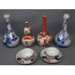 Two Kutani vases, two further blue printed vases and two Imari type teabowls and saucers