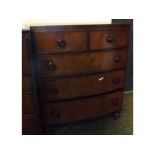 19th century mahogany bow fronted two over three full width drawer chest with turned knob handles