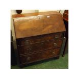 19th century mahogany three-drawer bureau with replacement brass swan neck handles, raised on