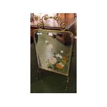 Late 19th century brass framed and flower painted mirrored fire screen, 17 1/2 ins wide