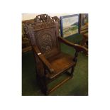 19th century oak wainscot chair with heavily carved panelled back, bearing date 1632, with carved