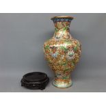 20th century cloisonn vase with raised enamel detail of flowers among scrolls, on a modern turned