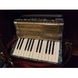 Alvari accordion complete with carrying case, 13 1/2 ins wide
