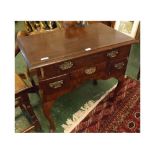 18th century walnut lowboy fitted with four varying sized drawers raised on pad feet with associated