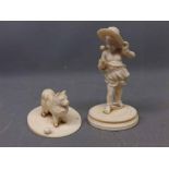 19th Century carved ivory model of a Winged Putti wearing a hat on a circular plinth, together