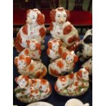Collection of eight various 20th century Staffordshire style models of dogs (4 pairs)