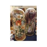 Large pair of Victorian silk work flower decorations under glass domes with circular gilded wood