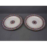 Pair of 19th century 10ins dinner plates with a blue and rust floral centre and repeating designed