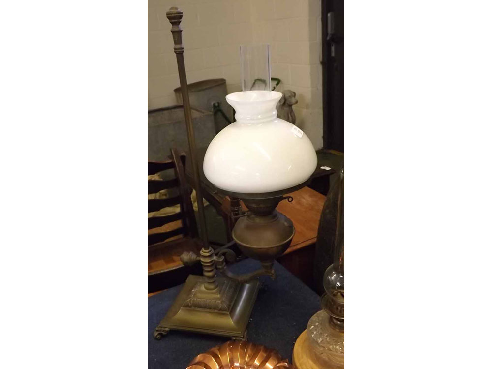 Victorian brass reading lamp, raised on a square plinth with an adjustable column with lamp