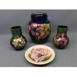 Group of 4 Moorcroft items to include a Hibiscus patterned, lidded ginger jar, decorated in