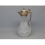 Silver plated mounted cut glass claret jug with shaped handle with Griffin finial, 12ins tall