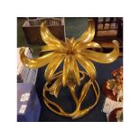 Modern gilt twisted metal floral table centre piece in the form of an open Lily, 19ins diameter x