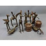 8 assorted African bronze cast figures to include 2 with pestle and mortars, 2 on Horseback etc,