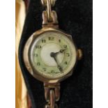 9ct gold ladies dress watch, the jewelled movement to a silvered and mother of pearl dial with