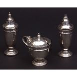 Elizabeth II three-piece cruet set comprising salt and pepper casters and lidded mustard, each of