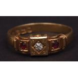 Late Victorian 18ct gold diamond and ruby ring, the central small circular old cut diamond flanked