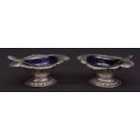 Two Indian white metal open salts each of lobed oval form and with chased and engraved decoration