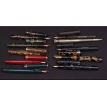 Mixed Lot: nine assorted fountain pens including Watermans and Parker pens, together with a base