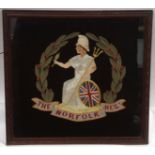 Early 20th century oak framed Regimental needlework depicting the badge of The Norfolk Regt on a
