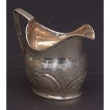 George III milk jug, an oval form with applied reeded rim and handle, with later embossed body,