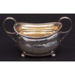 George III two-handled sugar basin of oval form with cast and applied wrythen gadrooned border and