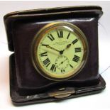 Early 20th century purple leather cased folding timepiece, the hinged case to a knurled bezel to