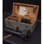 Mid-20th century gun sighting telescope, the grey painted and fitted wooden case with hinged