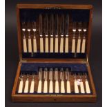 Early 20th century out cased canteen of dessert knives and forks for twelve, each with plain