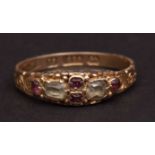 Early 20th century 15ct gold ruby and peridot ring, the small peridots interspersed with four