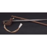 19th century cavalry sword and scabbard, the single edged slightly curved blade with double edged