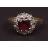 18ct gold garnet and diamond cluster ring, the circular faceted garnets surrounded by ten small