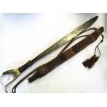 Borneo Mandau, the heavy single edged blade with shaped decoration and inlaid brass detail to a