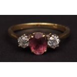 yellow metal, tourmaline and diamond three stone ring, the oval shaped faceted tourmaline (7mm x