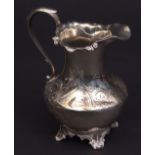 Victorian milk jug of baluster form with applied rim and C-scroll handle with engraved body and