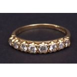 Modern 18ct gold and diamond ring, a row of eight small graduated brilliant cut diamonds (approx