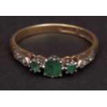 Early 20th century precious metal, emerald and diamond ring, the centre small cushion shaped emerald