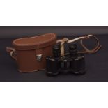Pair of WWII period Government issue binoculars, of typical form with painted red screw heads and