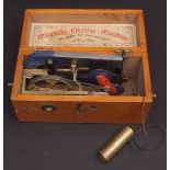 Early 20th century wooden cased Magneto electric machine of typical construction in hinged