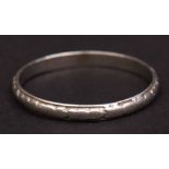 Platinum wedding ring, with part engraved decoration, 7.4gms, finger size Q
