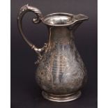 Victorian baluster milk jug with cast and applied rim and spout and leaf capped handle on a