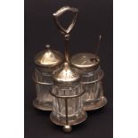 George VI silver cruet fitted with three clear glass silver topped bottles, looped handle, Sheffield