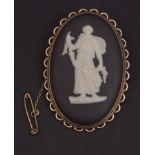 Vintage Wedgewood black and white jasper ware brooch, the oval plaque (45 x 30mm), depicting a