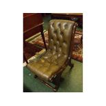 Reproduction mahogany Regency style button back low nursing chair with brass caps